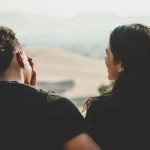 Couple looking out over fields